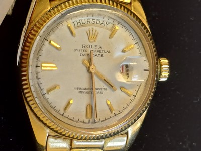 Lot 2138 - Rolex: A Rare 18 Carat Gold Automatic Day/Date...