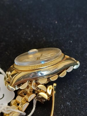 Lot 2138 - Rolex: A Rare 18 Carat Gold Automatic Day/Date...