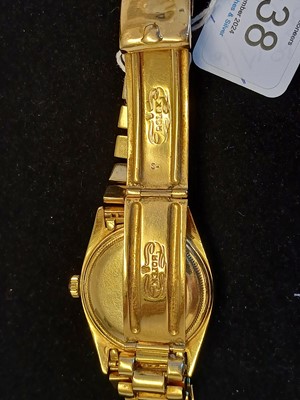 Lot 2138 - Rolex: A Rare 18 Carat Gold Automatic Day/Date...