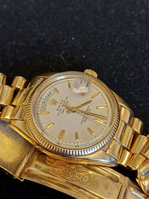 Lot 2138 - Rolex: A Rare 18 Carat Gold Automatic Day/Date...