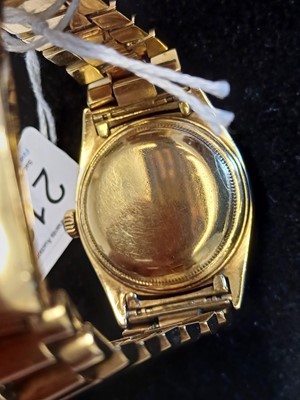 Lot 2138 - Rolex: A Rare 18 Carat Gold Automatic Day/Date...