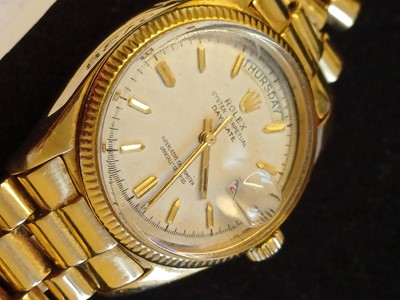 Lot 2138 - Rolex: A Rare 18 Carat Gold Automatic Day/Date...
