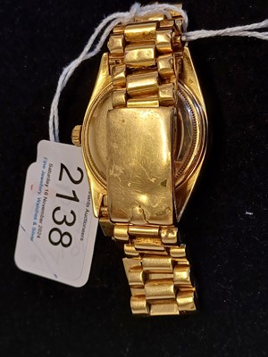 Lot 2138 - Rolex: A Rare 18 Carat Gold Automatic Day/Date...