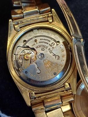 Lot 2138 - Rolex: A Rare 18 Carat Gold Automatic Day/Date...