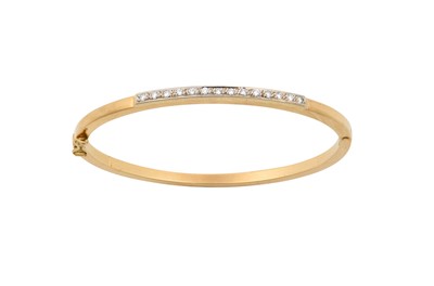 Lot 2081 - An 18 Carat Gold Diamond Bangle the yellow...