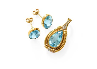 Lot 398 - A Blue Topaz and Diamond Pendant, the pear cut...