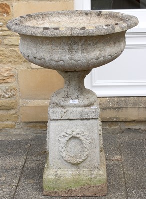 Lot 1174 - A Weathered Composition Pedestal Urn, on...