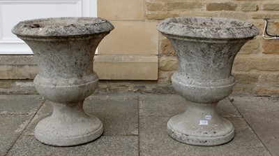 Lot 1176 - A Pair of Weathered Composition Garden Urns,...