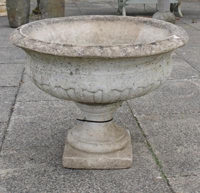 Lot 1183 - A Weathered Composition Garden Urn, with...