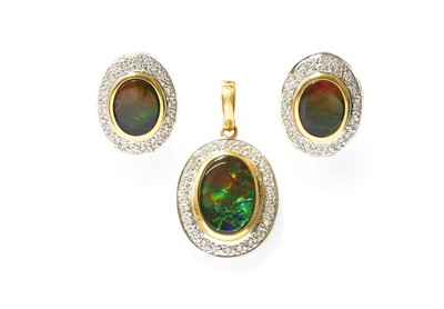 Lot 357 - An Ammolite Composite and Diamond Pendant and...