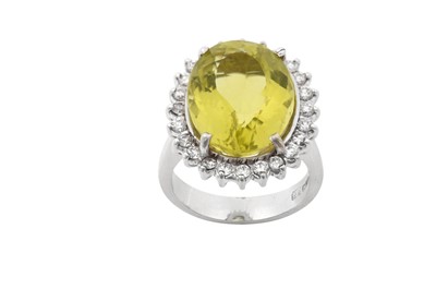 Lot 2098 - A Citrine and Diamond Cluster Ring the oval...