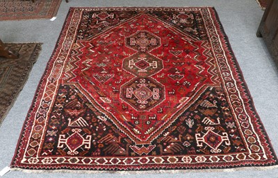 Lot 1214 - Kashgai Rug, the lozenge shaped blood red...