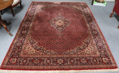 Lot 1221 - An Indian Carpet, the blood red Herati field...