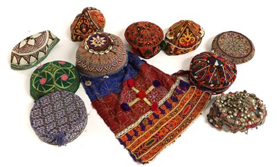 Lot 2121 - Twelve Afghan and Eastern Hats woven in...