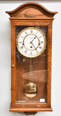 Lot 1433 - An Oak Cased Chiming Wall Clock, by Comitti of...