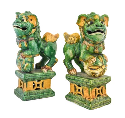 Lot 592 - A Pair of Chinese Sancai Glazed Dogs of Fo, in...