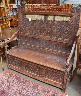 Lot 1423 - An 18th Century Oak Box Settle, with arched...