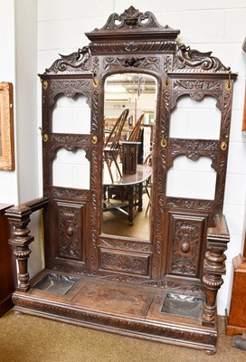 Lot 1439 - A Carved Oak Mirror Back Hall Stand, of...