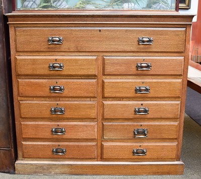 Lot 1428 - An Edwardian Light Oak Straight Fronted Chest...