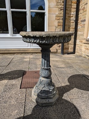 Lot 1220 - A Composition Garden Bird Bath, with fluted...