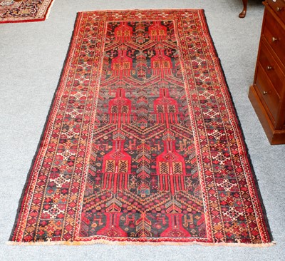 Lot 1294 - Baluch Rug, the charcoal field with a one-way...