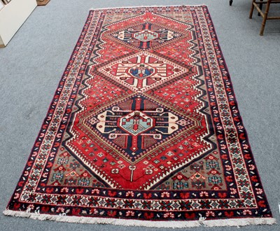 Lot 1296 - North West Persian Village Rug, the blood red...