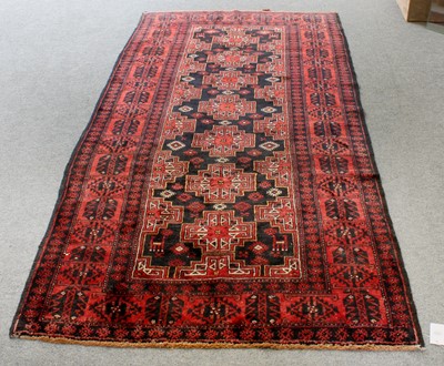 Lot 1291 - Baluch Rug, the charcoal field with a single...