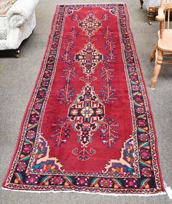 Lot 1281 - Kurdish Rug, the soft aubergine field with a...