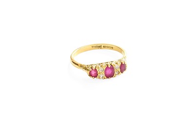 Lot 47 - An 18 Carat Gold Ruby and Diamond Ring, three...