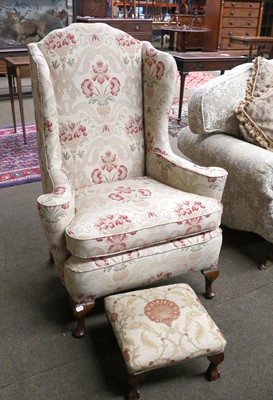 Lot 1516 - A George III Style Upholstered Wing Back Chair,...