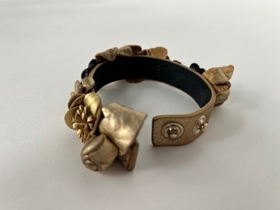 Lot 1043 - Circa 2018 Chanel Gold Leather Camelia Flower...