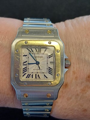 Lot 2132 - Cartier: A Steel and Gold Automatic Calendar...