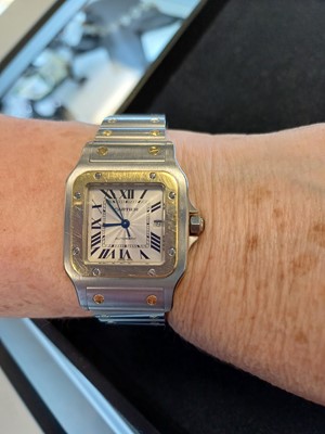 Lot 2132 - Cartier: A Steel and Gold Automatic Calendar...