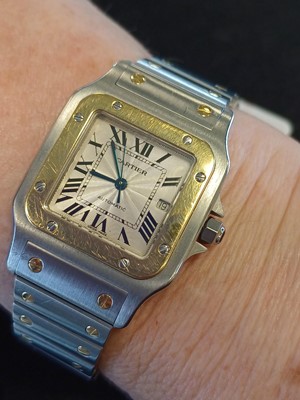 Lot 2132 - Cartier: A Steel and Gold Automatic Calendar...