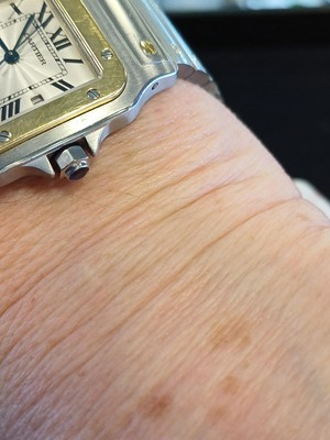 Lot 2132 - Cartier: A Steel and Gold Automatic Calendar...