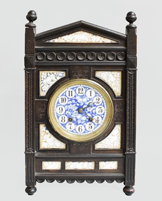 Lot 223 - An Ebonised and Porcelain Striking Mantel...