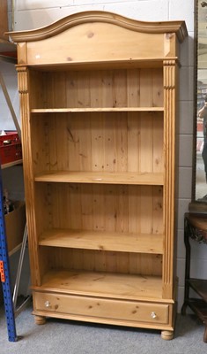 Lot 1302 - An Open Pine Bookcase, arched pediment, three...