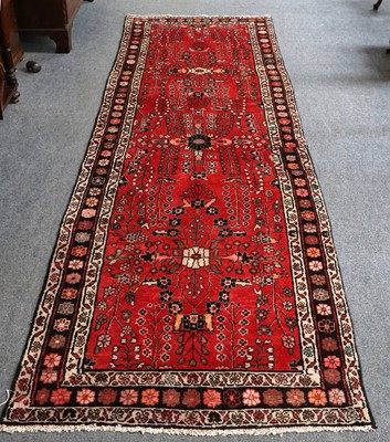 Lot 1151 - Hamadan Runner, the abrashed blood red field...