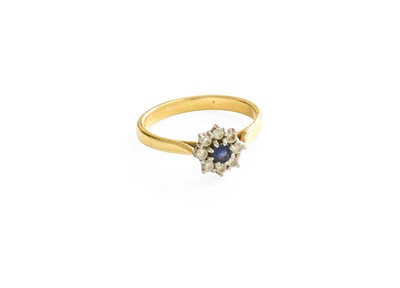 Lot 114 - An 18 Carat Gold Sapphire and Diamond Cluster...