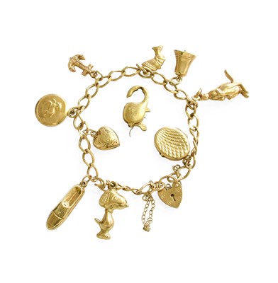 Lot 120 - A 9 Carat Gold Charm Bracelet, suspending nine...