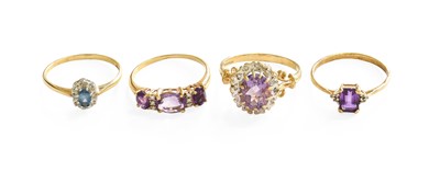 Lot 111 - Four Dress Rings, comprising of a 9 carat gold...