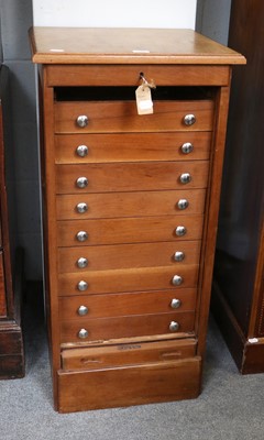 Lot 1266 - A Tambour Fronted Nine Height Wellington Style...