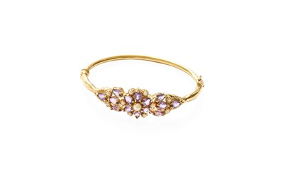 Lot 289 - An Amethyst and Cultured Pearl Bangle, stamped...