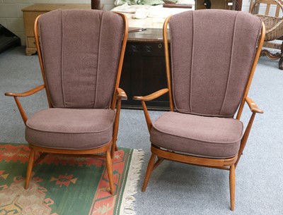 Lot 1210 - A Pair of Ercol Elm Armchairs, course woolen...