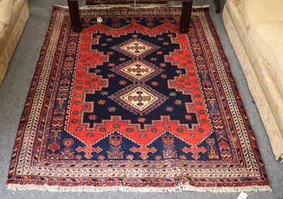 Lot 1232 - Afshar Rug, the indigo crenellated field with...