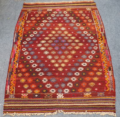 Lot 1212 - Anatolian Kilim, the deep brick red abrashed...