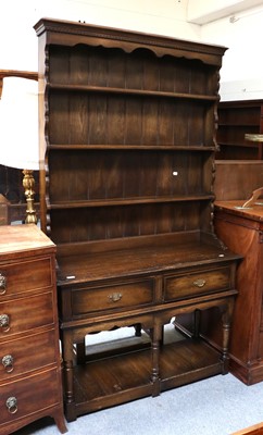 Lot 1324 - A 20th Century Oak Dresser, moulded cornice...