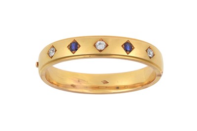 Lot 2219 - A Sapphire and Diamond Bangle the broad yellow...