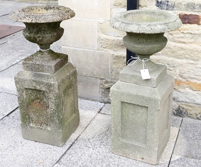 Lot 1227a - A Pair of Urns, on square plinth bases, 81cm high