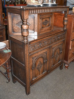 Lot 1211 - A Jacobean Style Carved Oak Court Cupboard,...